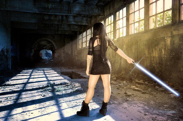 A cosplayer holding a meticulously crafted prop weapon that looks realistic, with attention to weathering and details. The background is a blurred shot of a convention floor.