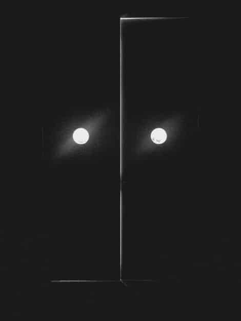 A split-screen image showing the sharp contrast in the visual aesthetics between Moon Dong-eun's dark and minimalist aesthetic and Park Yeon-jin's bright and opulent style. Illustrate how visual elements highlight their contrasting lives and personalities.