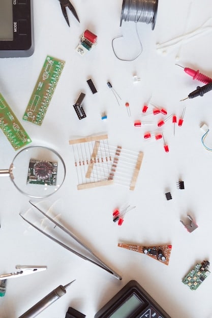 A selection of affordable electronic components laid out neatly on a table, including LEDs, resistors, switches, and a small sound module. The background shows various tools used in electronics projects, such as a multimeter and soldering iron.