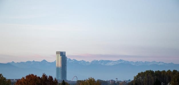 A panoramic view of Silicon Valley, showcasing modern office buildings with logos of famous tech companies, set against the backdrop of rolling hills and a clear blue sky.