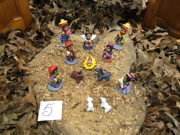 A close-up of various miniatures representing different characters in a US Tabletop RPG campaign. The miniatures are highly detailed, showcasing diverse races, classes, and equipment, each reflecting a unique personality and backstory.