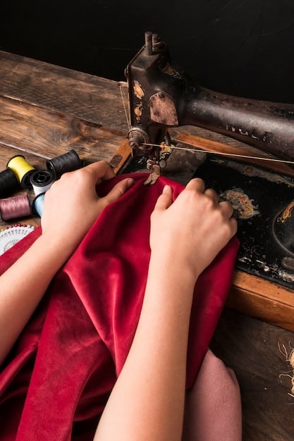 A close-up shot of a cosplayer working on a sewing machine, carefully stitching together fabric for their costume. The focus is on the hands and the intricate details of the sewing process.