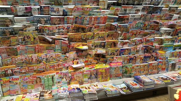 A display case filled with graded and slabbed comic books at a comic book convention. The comics are arranged neatly, showing off their pristine condition and professional encapsulation.