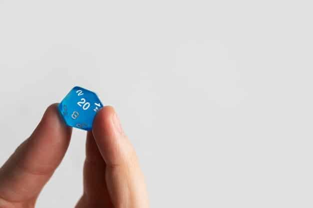 A close-up shot of a hand rolling a set of polyhedral dice on a gaming table. The dice are colorful and have intricate designs, adding to the visual appeal. The background is blurred to focus on the dice and the action of rolling.