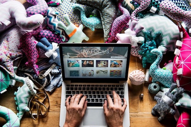 A laptop displaying a popular streaming service, with various geek-related content thumbnails visible, such as gaming streams, anime series, and sci-fi movies. The image represents the accessibility and diversity of geek content in the digital age.