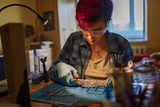 A person working on a complex electronics project at their desk, surrounded by tools, wires, and circuit boards, representing the maker and tech-enthusiast side of geek culture.