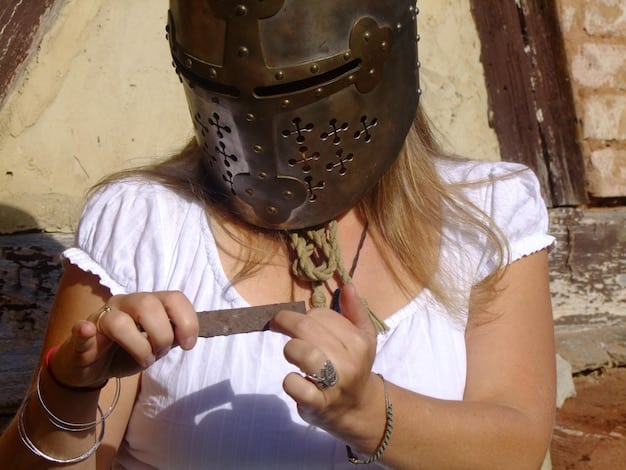 A close-up of a cosplayer's hands intricately detailing a piece of armor with paint and weathering effects. The focus is on the meticulous brushstrokes and the texture being created, demonstrating the dedication and artistry involved in crafting realistic cosplay props.