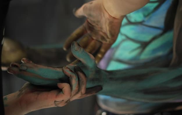 A close-up shot of a cosplayer's hands meticulously crafting intricate details on a piece of armor using EVA foam and various crafting tools. The image highlights the fine motor skills and attention to detail required for high-quality cosplay.