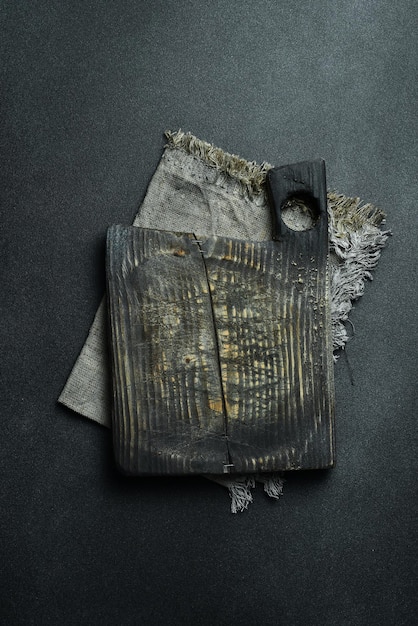 A close-up shot of a well-worn paperback science fiction novel lying open on a table next to a steaming mug of coffee. The pages are yellowed, and the cover shows signs of wear and tear, suggesting it has been read many times.