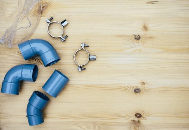 A collection of inexpensive materials laid out on a table, including PVC pipes, plumbing fittings, LED lights, switches, and electrical wiring, with tools like a soldering iron, sandpaper, and paintbrushes arranged beside them. The scene suggests the raw components needed to start a DIY lightsaber project.