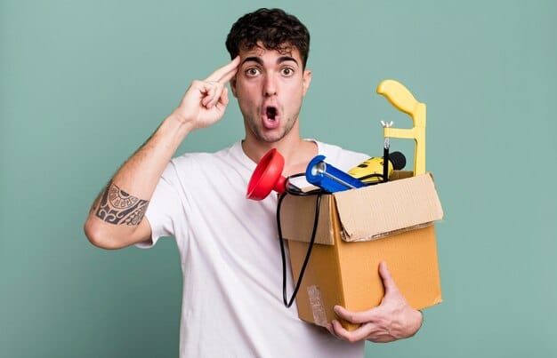 A person enthusiastically unboxing a geek subscription box, revealing a variety of items, including a t-shirt, a small figurine, a comic book, and a sticker. The expression is one of excitement and anticipation.