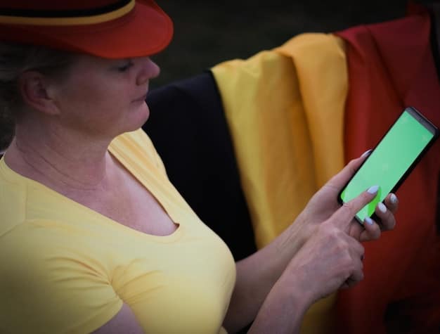 A close-up screenshot of the Pokémon Go app on a smartphone. The screen shows a player encountering a Pikachu in their living room, with the real-world furniture visible in the background through the augmented reality feature.