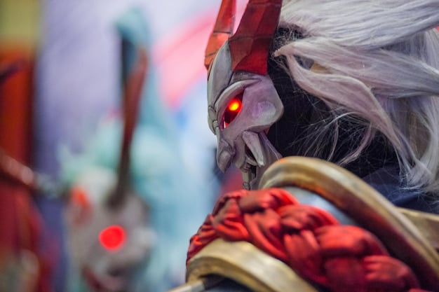 A close-up shot of a cosplayer meticulously working on a part of their costume. There are visible tools like sewing machines, fabric scraps, and design sketches scattered around. The focus is on the fine details and craftsmanship involved.