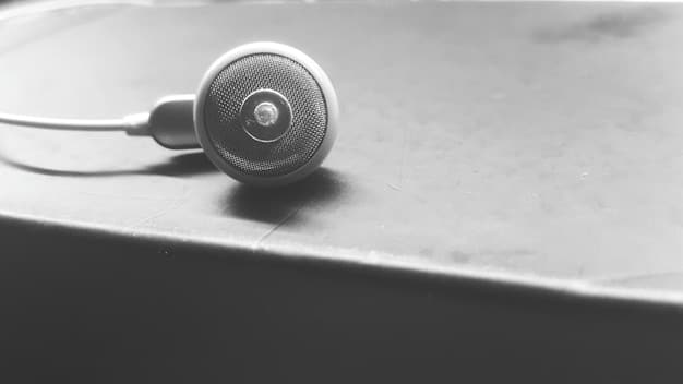 A close-up shot of a vintage microphone with headphones resting on it, symbolizing the audio nature of podcasts and the nostalgia often associated with geek culture. The background is blurred, highlighting the microphone as the centerpiece.
