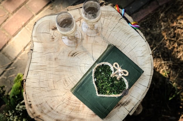 A wedding reception table decorated with a centerpiece featuring stacked vintage books, a small framed map of Middle-earth, and flickering LED candles, subtly themed around a Tolkien-inspired wedding.