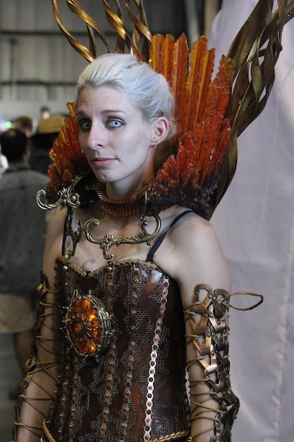 A close-up shot of a cosplayer meticulously adjusting the intricate details of their costume. The cosplayer is focused and surrounded by various crafting tools and materials. The character they are cosplaying is not immediately discernible.