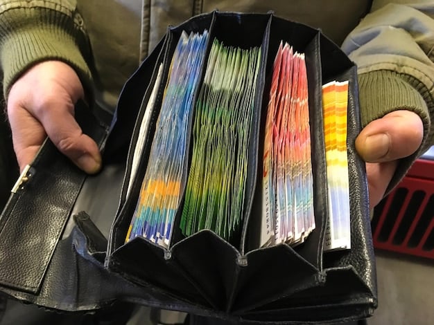 A close-up shot of a collector meticulously organizing a binder filled with various K-Pop photocards, showcasing the diversity and collectibility of these items. The lighting highlights the glossy finish and vibrant colors of the cards.