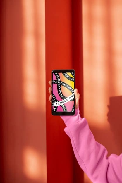 A hand holding a K-Pop album, showcasing the album's packaging details such as holographic stickers and official logos. The background is slightly blurred to keep the focus on the album details, emphasizing the importance of checking these features for authenticity.