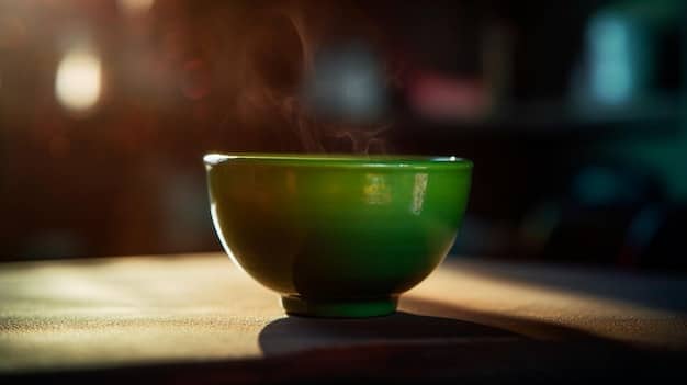 A close-up shot of a beautifully crafted Korean tea cup filled with tea, highlighting the details of the cup and the color of the tea. The image should emphasize the aesthetic appreciation of the tea ceremony.