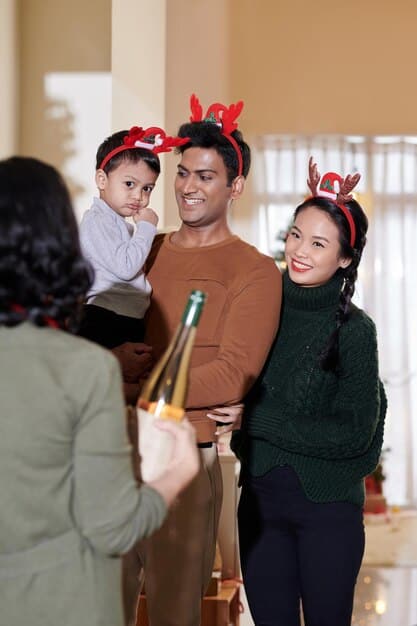 A medium shot of a Korean American family performing Sebae (New Year's bow) during Seollal celebrations in their home in the US. The elders are seated, and the children are bowing respectfully in traditional Hanbok.