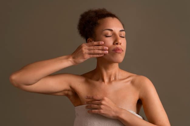 A close-up shot of a woman gently massaging an oil cleanser onto her face. Her eyes are closed, and she appears relaxed. The focus is on her hands and the texture of the cleanser on her skin.