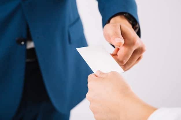 A close-up of hands exchanging business cards in a formal Korean business setting, emphasizing the importance of the gesture and etiquette involved in the exchange.