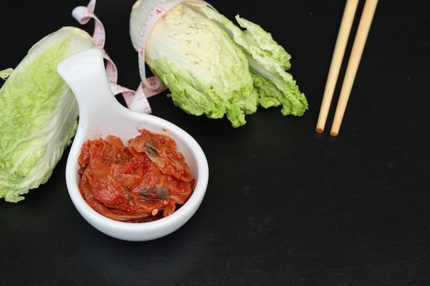 A well-organized display of kimchi ingredients, including napa cabbage, Korean radish, gochugaru (Korean chili powder), garlic, ginger, fish sauce, and Korean pear. Each ingredient is clearly labeled, and the arrangement is visually appealing.