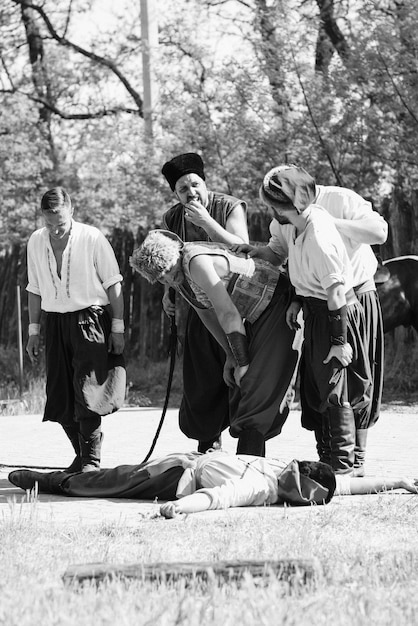 A black and white photograph of a Korean Taekwondo master teaching a class of American soldiers during the Korean War era, showcasing the early introduction of Taekwondo to the United States.