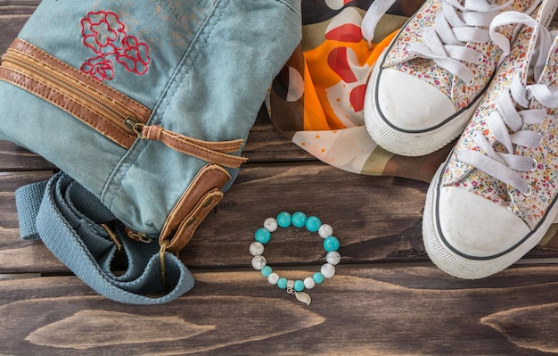 A close-up shot showcasing various K-pop inspired accessories, including chunky jewelry, unique bags, and trendy sneakers.