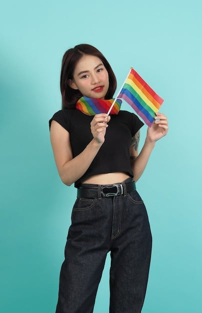A photo of a K-Pop fan holding a rainbow flag at a pride parade, with a sign supporting LGBTQ+ rights. The image conveys solidarity and support from the K-Pop community.