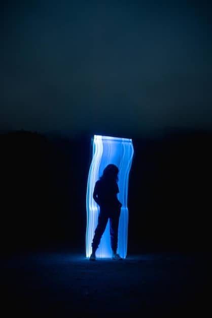 A still from a K-Pop music video featuring a member standing in front of a cracked mirror with seven reflections, symbolizing identity breakdown and reconstruction, with dramatic lighting effects.