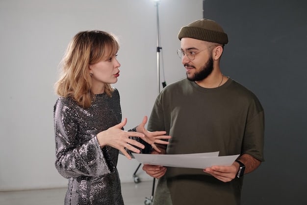A photograph of a K-Pop vocal coach working with a trainee in a studio setting. The focus should be on the coach's instructional gestures and the trainee's attentive expression.