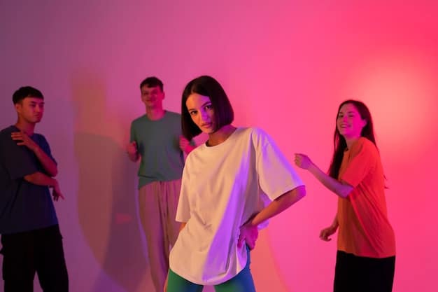 A still from a K-Pop music video featuring a group of dancers in vibrant, contrasting outfits against a dark backdrop, highlighting the strategic use of color to create visual impact and convey the energy of the performance.