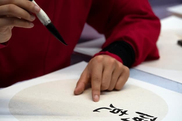 A calligrapher's hands demonstrating the correct way to hold a traditional Korean calligraphy brush, showing the angle and grip necessary for precise strokes, with a focus on the control and balance required.