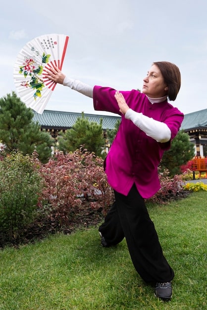 A person demonstrating the proper way to bow in Korean culture. The image captures the posture and angle of the bow, indicating respect and humility during the greeting.