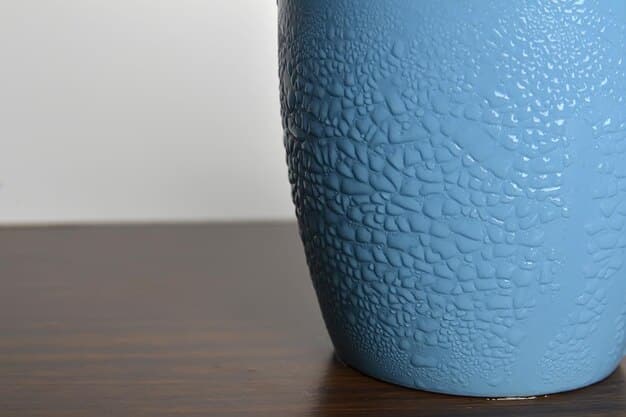A detailed close-up of a celadon vase, showcasing the subtle, smooth texture and the characteristic jade-green glaze. The vase has a simple, elegant shape, reflecting the Korean emphasis on natural forms and understated beauty.
