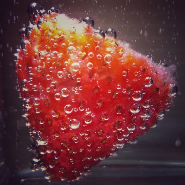 A close-up shot of kimchi fermenting in a glass jar, showing small bubbles rising to the surface, with a focus on the vibrant colors and textures of the kimchi mixture.