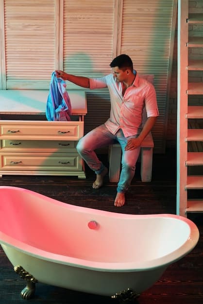 A person is shown performing the double cleansing method in a well-lit bathroom. They are massaging an oil-based cleanser onto their face, preparing to remove makeup and impurities effectively. The scene conveys a sense of meticulous skincare.