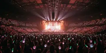Energetic K-Pop concert with fans and lightsticks in a US arena